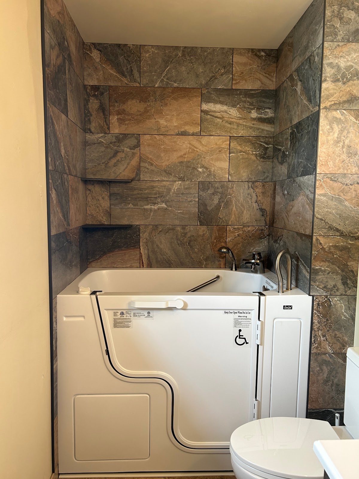 Walk-in tub with a tiled surround