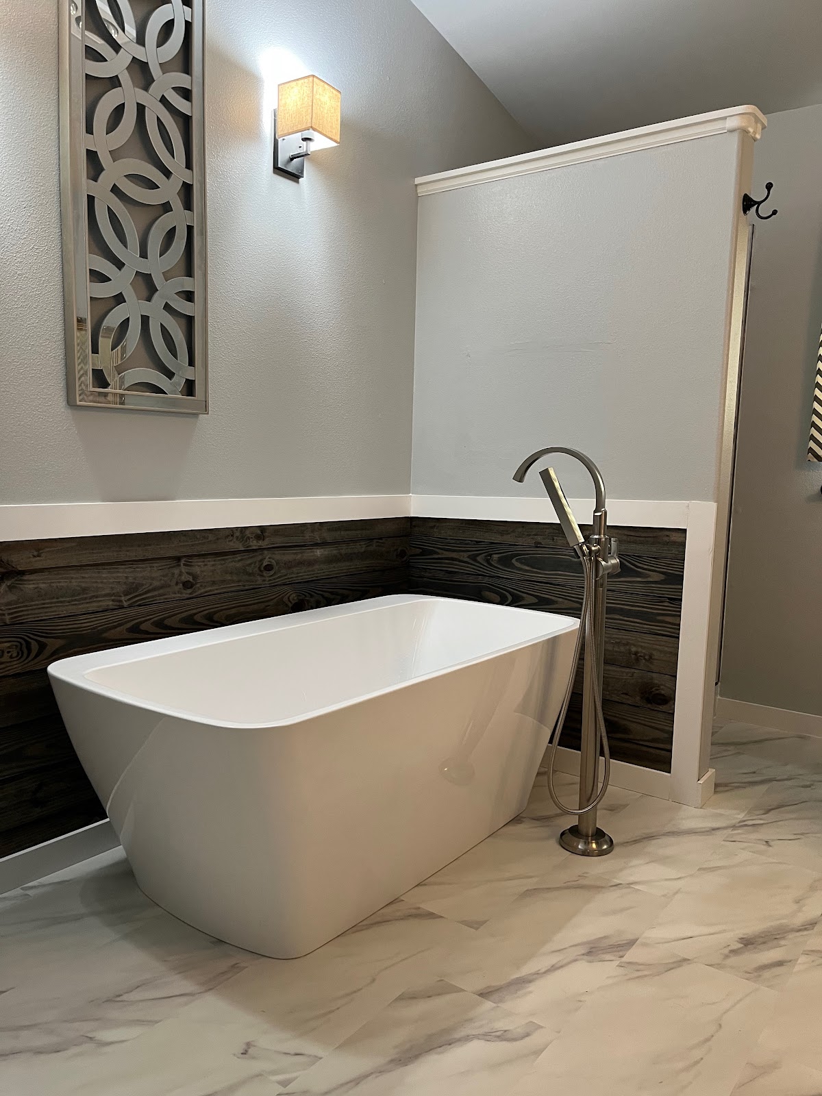 Freestanding tub with a floor-mounted filler installed by O'Neil Plumbing