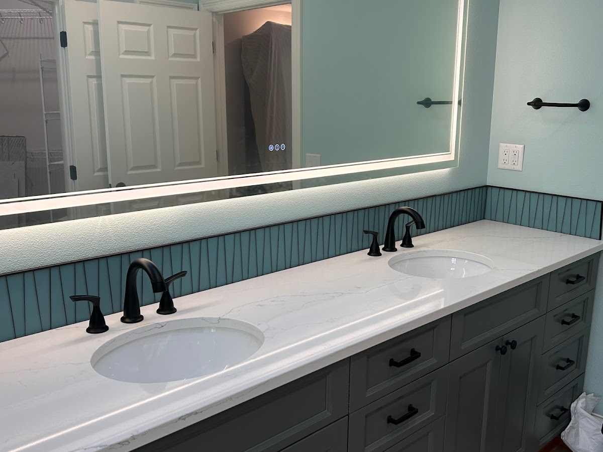 Double vanity with a backlit mirror